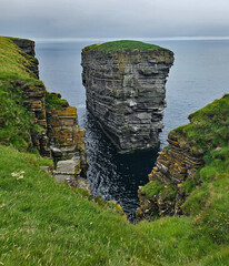 Wonderful views of the cliffs with islands and birds in the Scottish Highlands near Thurso