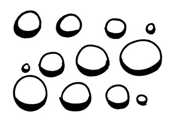 A collection of hand-drawn circles, varying in size and scattered across a white background, symbolizing abstract shapes and simple forms
