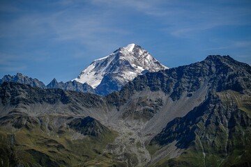 High resolution image of a close up of one of the Swiss Alp peak covered with snow and ice with a clear skies. Seen from the famous TMB- Tour du Mont Blanc trail