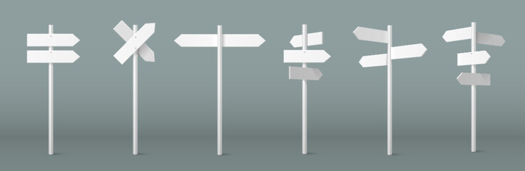Arrow sign on pole set with white directional markers on posts for wayfinding and navigation systems. Crossroad signposts with multiple pointing boards for outdoor guidance. Street direction indicator © klyaksun