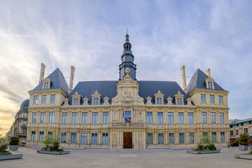 City Hall of Reims stands majestic in golden hues at dusk France