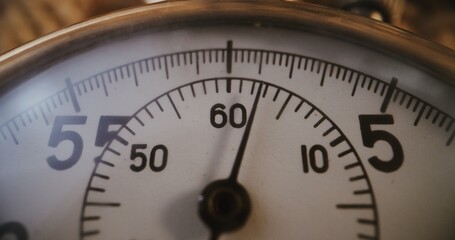 Macro Close Up Shot of Mechanical Stopwatch with Metallic Case and Clear Dial with Running Second Hand. Concept of Measurement, Countdown, Sports Training and Competitive Athletic Timing. Time Lapse.