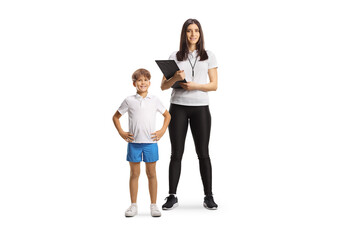 Fototapeta premium Female sports coach and boy posing together