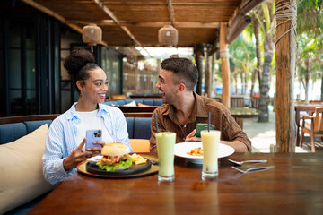 A diverse couple creates social proof as content drives reviews, bookings, loyalty and growth