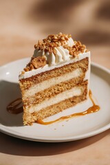 butterscotch cake Pastry with caramel sponge, creamy layers, and crunchy praline on white plate