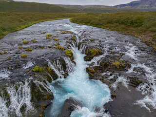 Aerial View of Bruarfoss Waterfall in Iceland with Turquoise Glacial Water
