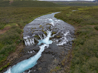 Aerial View of Bruarfoss Waterfall in Iceland with Turquoise Glacial Water
