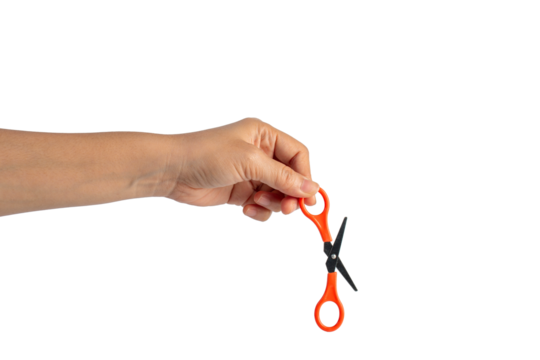 Small orange scissors in hand on transparent background - Powered by Adobe