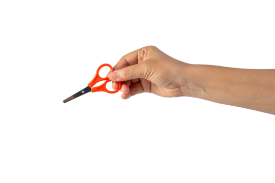 Small orange scissors in hand on transparent background