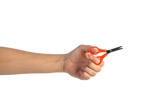 Small orange scissors in hand on transparent background