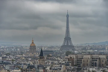 Fotobehang Eiffeltoren Paris, France - 09 24 2025: Panoramic view of the south of Paris with Eiffel Tower and Hotel des Invalides tower from top of The towers of Notre-Dame Cathedral De Paris  © Franck Legros
