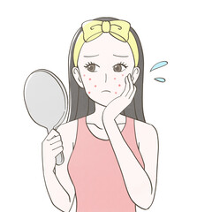 ニキビが気になり鏡を見る女性