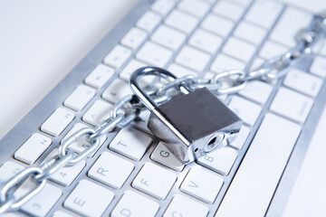 Lock and chain on the keyboard of a laptop. Internet security concept.