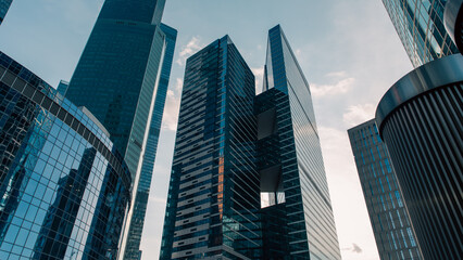 bottom view of the tall skyscrapers of the business district of a modern city