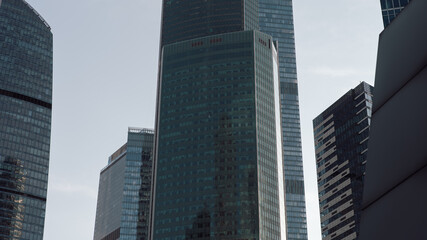 bottom view of the tall skyscrapers of the business district of a modern city