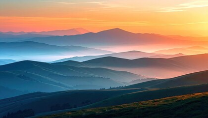Sunrise over layered mountain ranges