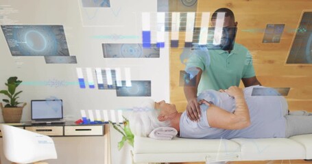 Therapist placing hand on shoulder and pressing while monitoring physiotherapy graphs with panels - Powered by Adobe