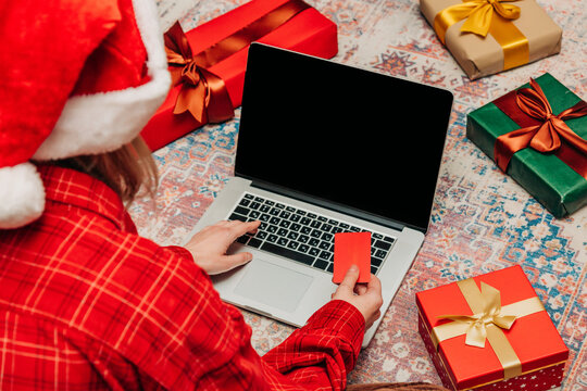 woman searches for Christmas presents online - Powered by Adobe