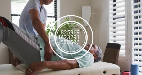 Physiotherapist starting leg assessment in clinic, lifting patient leg, updating overlay fading - Powered by Adobe