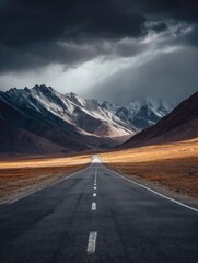 Naklejka premium dark gray, endless road leading through breathtaking mountains, nature art, wall art