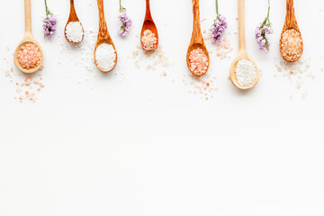 Naklejka na ściany i meble Spa treatment body care cosmetics - sea salt and scrubs in spoons, top view