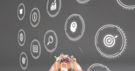 Upon icons fading in, camera tilting revealing pumpkin candy bowl, icons orbiting glowing circles - Powered by Adobe