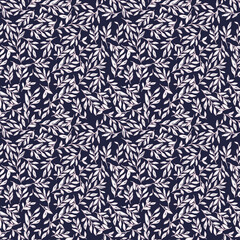 Seamless botanical pattern with hand-drawn white leaves on a dark navy blue background. Elegant foliage illustration with a sketchy texture for fabric and wallpaper. © Creativezone