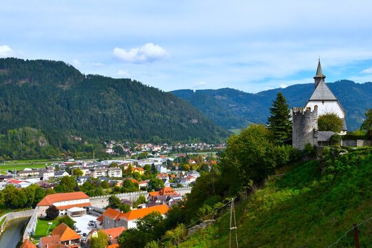 Church of St. Peter am Petersberg and a medieva defence tower on a hill above the town of Friesach in Carinthia, Austria
