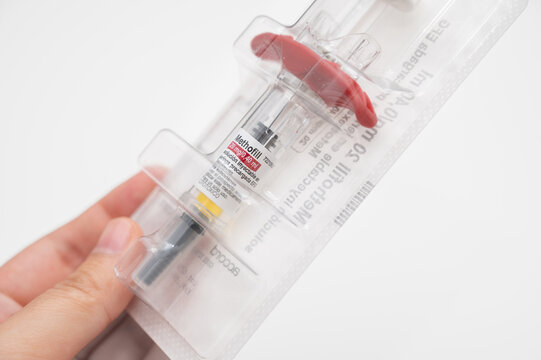 Hand holding Methofill pre filled syringe package for treatment