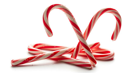 Fototapeta premium A close up of several candy canes with red and white stripes on a white surface