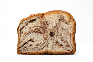a loaf of bread with chocolate swirls inside, isolated on white background