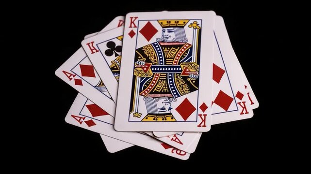 A pile of playing cards stacked on top of each other