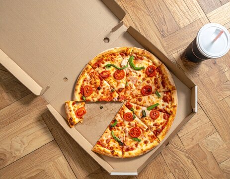 Delicious pizza with fresh toppings in a cardboard box, ready to eat.