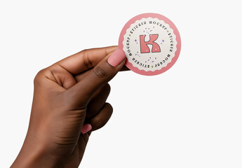 Woman's Hand Holding Sticker Mockup