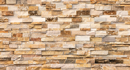 Natural Stone Brick Facade, close-up of a finely crafted brick wall, composed of expertly laid natural stone bricks, showcases the inherent beauty and timeless appeal of natural building materials.