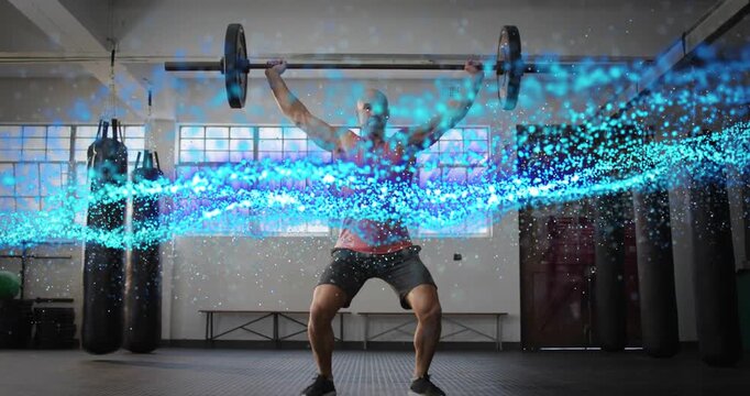 Male athlete gripping barbell, initiating snatch in fitness gym, blue particles tracing press squat