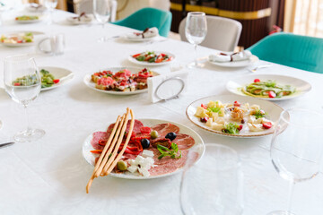 Elegant table setting with assorted dishes and fresh ingredients for a gathering