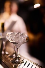 Empty Elegant Glasses With Ice Cubes	