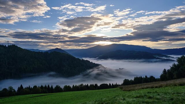 Time-lapse of a Dramatic Sunrise Over a Fog-Covered Mountain Valley , carpathians mountains