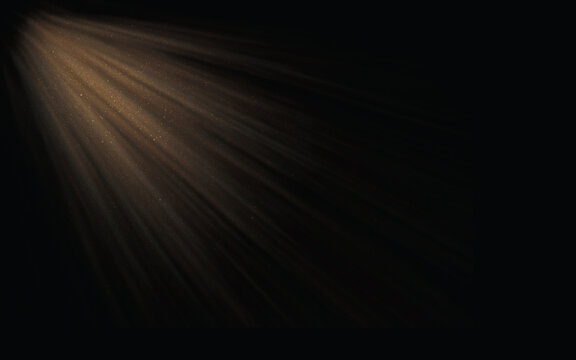 Golden sunbeams piercing through darkness creating a dramatic ethereal light effect on a black background
