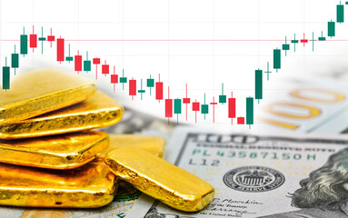 Paper us 100 dollar bill and gold bars with candlestick chart, concept of investment and saving wealth, copy space