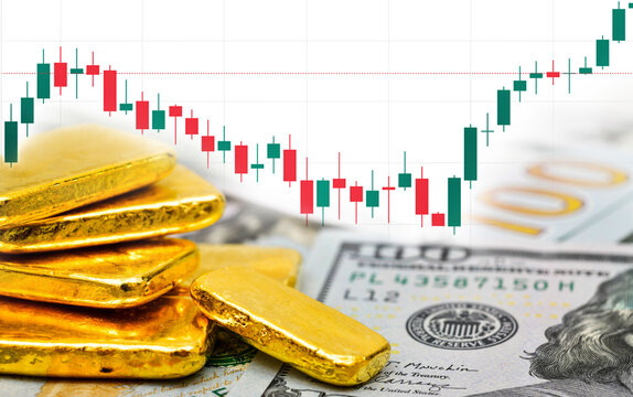 Paper us 100 dollar bill and gold bars with candlestick chart, concept of investment and saving wealth, copy space