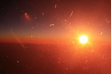 Sunset seen through airplane window, vibrant colors, atmospheric dust