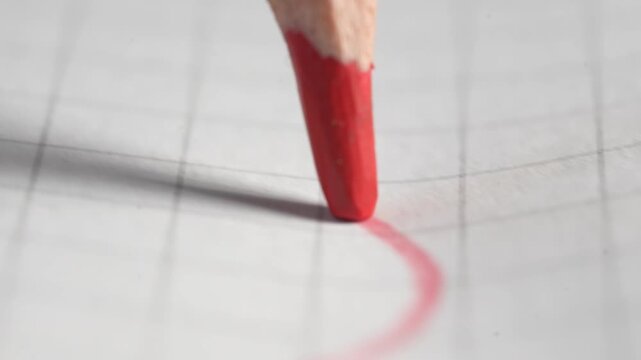Drawing lines on checkered paper with a red pencil