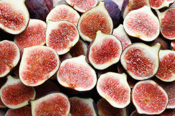 Pieces of ripe figs as background, top view