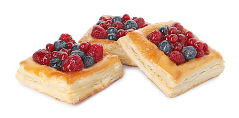Tasty puff pastries with berries isolated on white