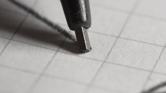 Making technical drawings with a coal -tipped pencil on paper