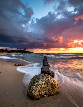 Dramatic sunset over beach and sea