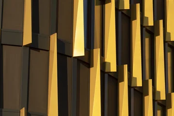 Fotobehang Honing An abstract closeup of the contemporary buildings golden facade highlights its angular elements, showcasing the dynamic nature of architectural design in the urban landscape  © Alena