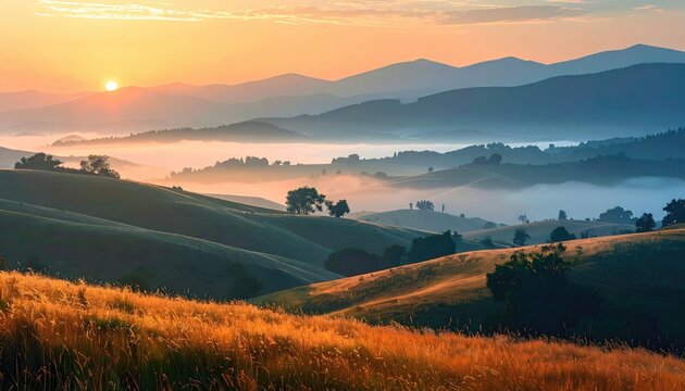 Sunrise over rolling hills, misty valley